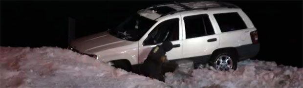 Jeep Grand Cherokee Does a Sled-Dog Impression on a Snowbank