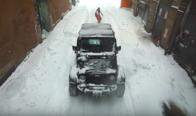 Snowboarding Behind a Jeep Wrangler Through NYC is Smile Fuel