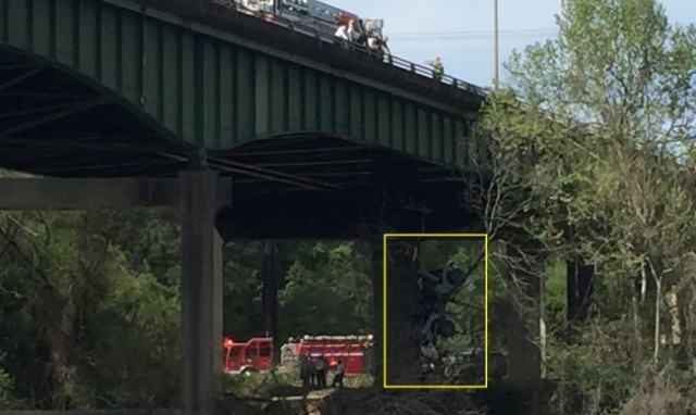 Jeep Caught in Tree After Nose Diving Off Bridge