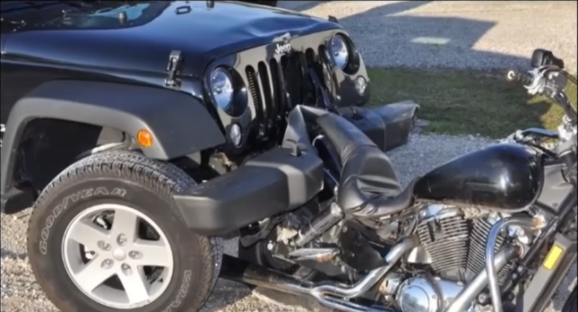 Wrangler Driver Hits Motorcycle, Then Pushes It Home