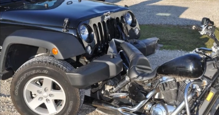 Wrangler Driver Hits Motorcycle, Then Pushes It Home
