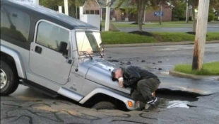 Sinkhole Nearly Swallows Jeep at Burger King