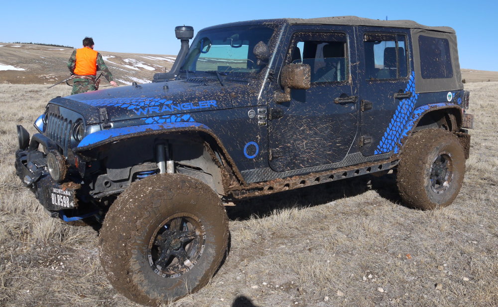 Blue Jeep Wrangler with Hose Fenders