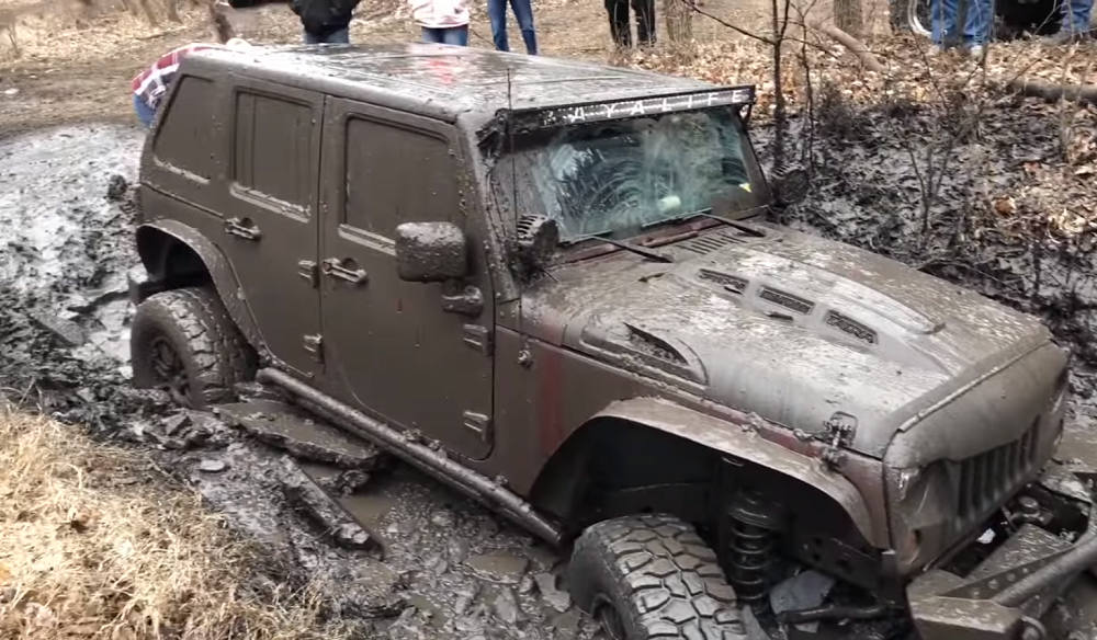 Jeep JL tows JK out of icy mud