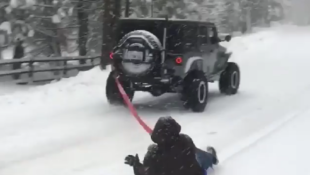 jk-forum.com Thrill-seeker Goes Sliding on the Snow - Behind a Jeep Wrangler!