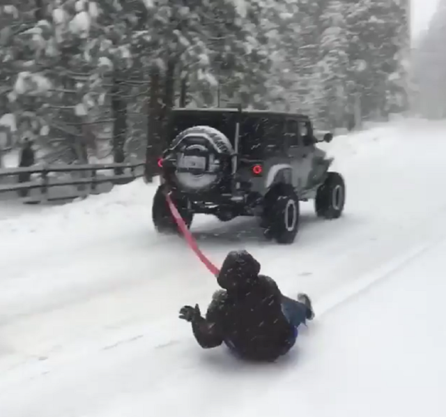 jk-forum.com Thrill-seeker Goes Sliding on the Snow - Behind a Jeep Wrangler!