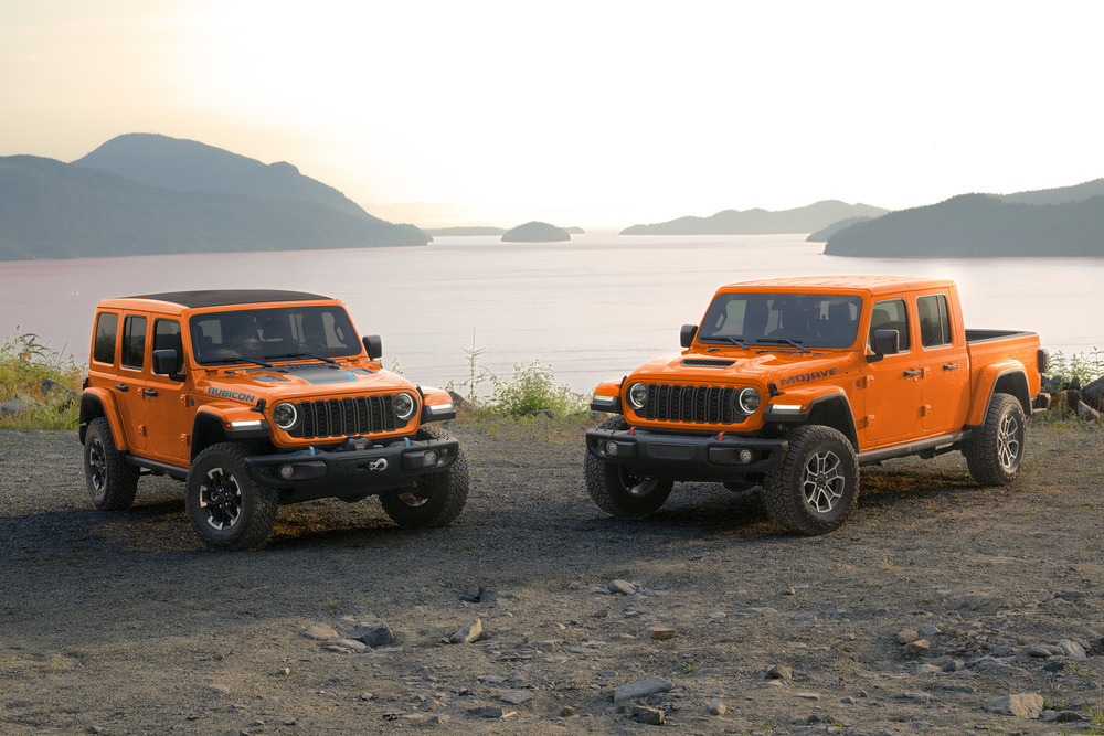 A Jeep Wrangler and Jeep Wrangler parked in scenic setting